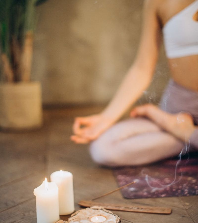 Woman in a serene yoga pose, embodying balance and tranquility.